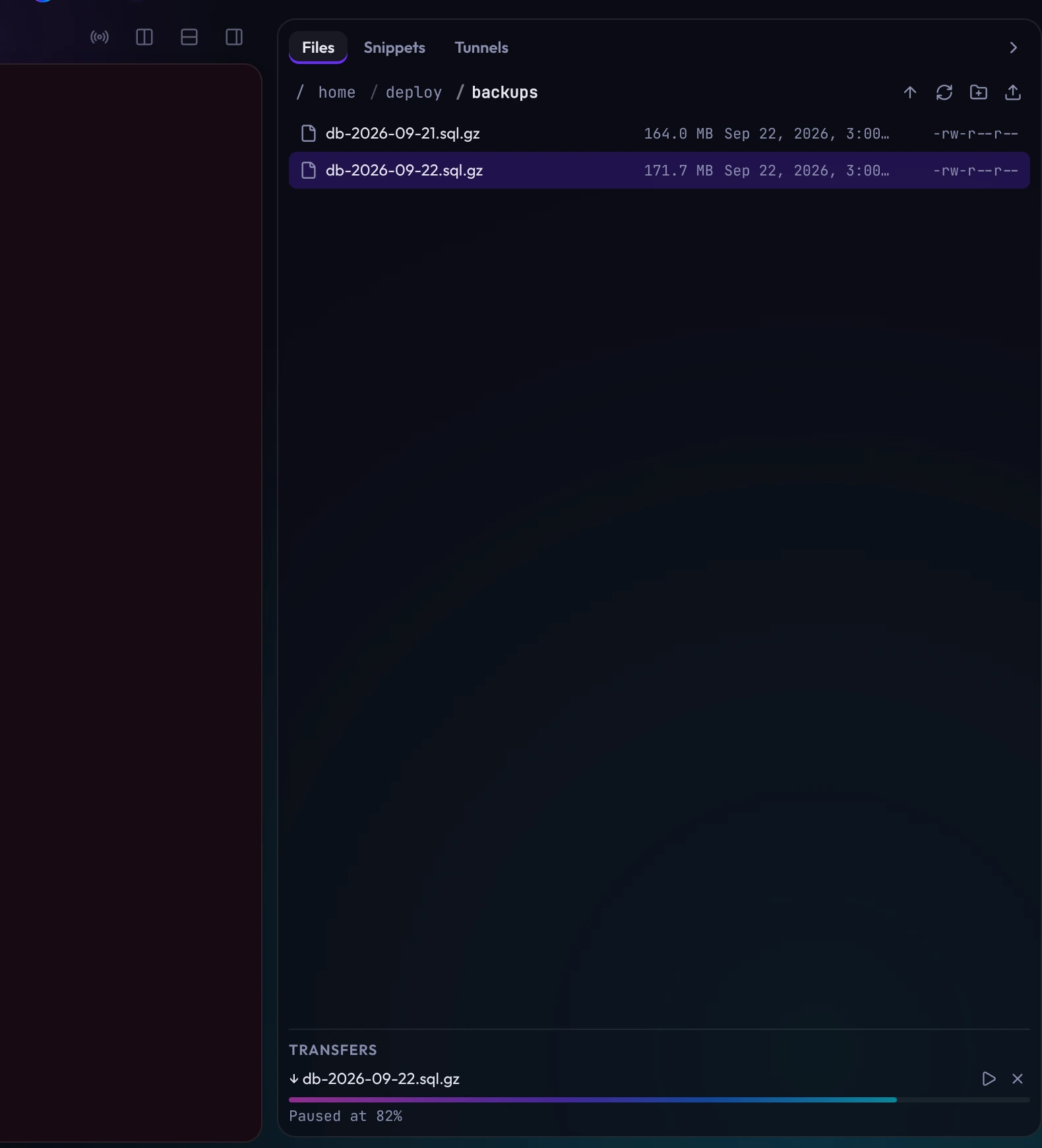 A terminal on web-01 beside the Files tray, showing the backups folder and a download paused part way in the Transfers list.
